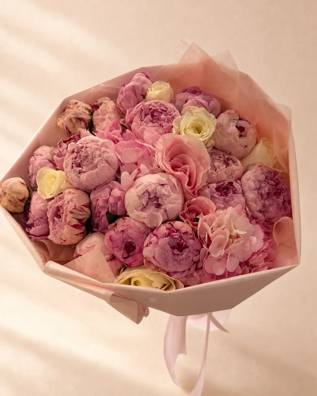 Peony Season: pink peonies with roses in blush wrap, on a blush backdrop